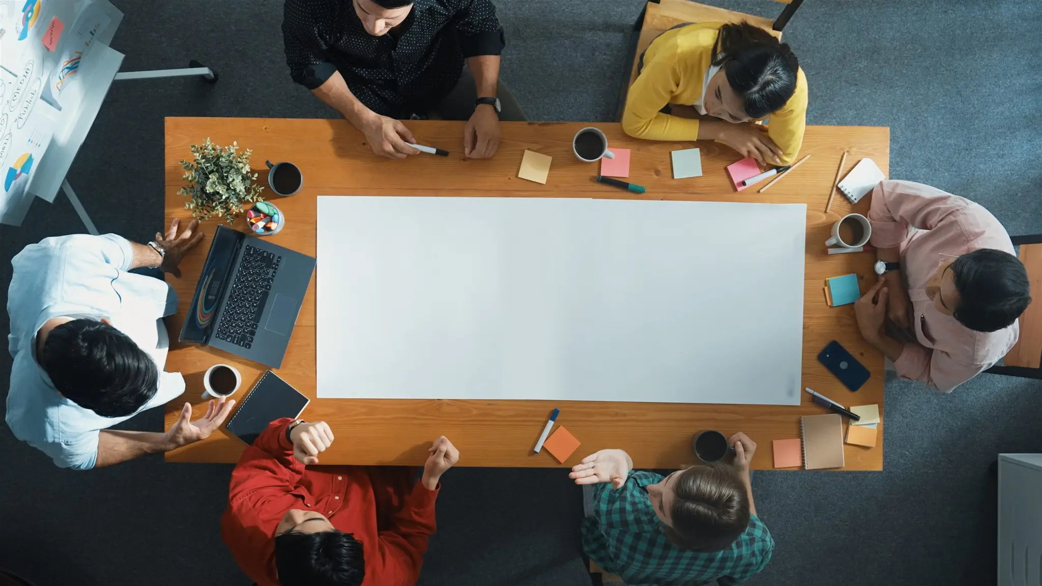 Team in a strategy planning session around a boardroom table